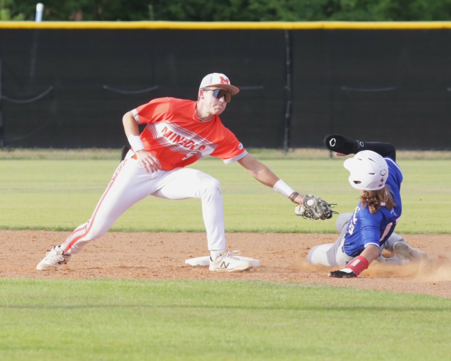 Mineola shortstop Spencer Joyner puts a tag on a Prairiland baserunner trying to steal second. Matthew Ballew’s throw arrived exactly where it needed to be to catch the runner.